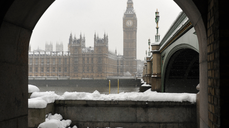Winter weather in London showing big ben and parliament with snow
