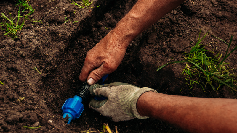 Engineer fixing a pipe underground